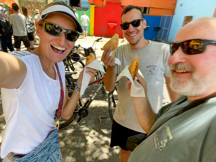 a group enjoying best empanadas