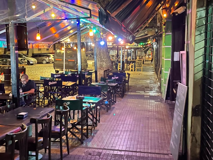traditional bar in buenos aires with tables on the sidewalk
