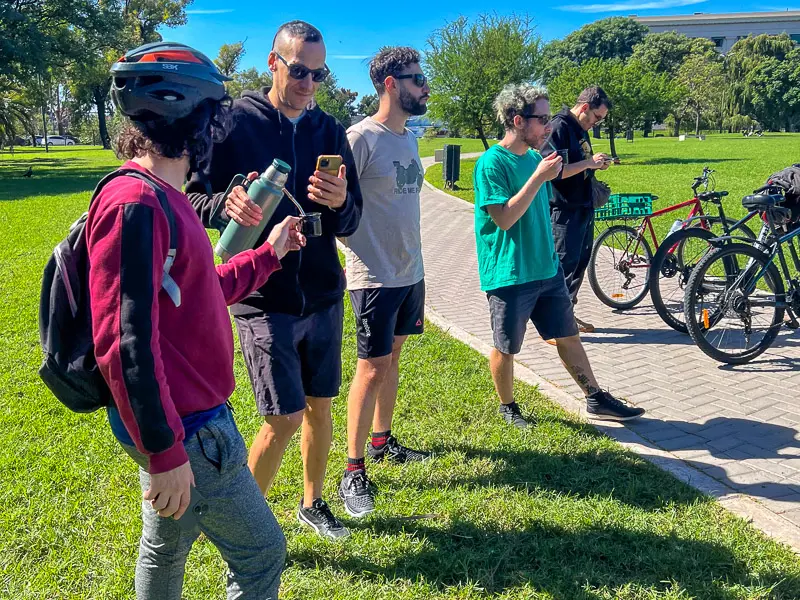 drinking mate in a bike tour stop at floralis generica