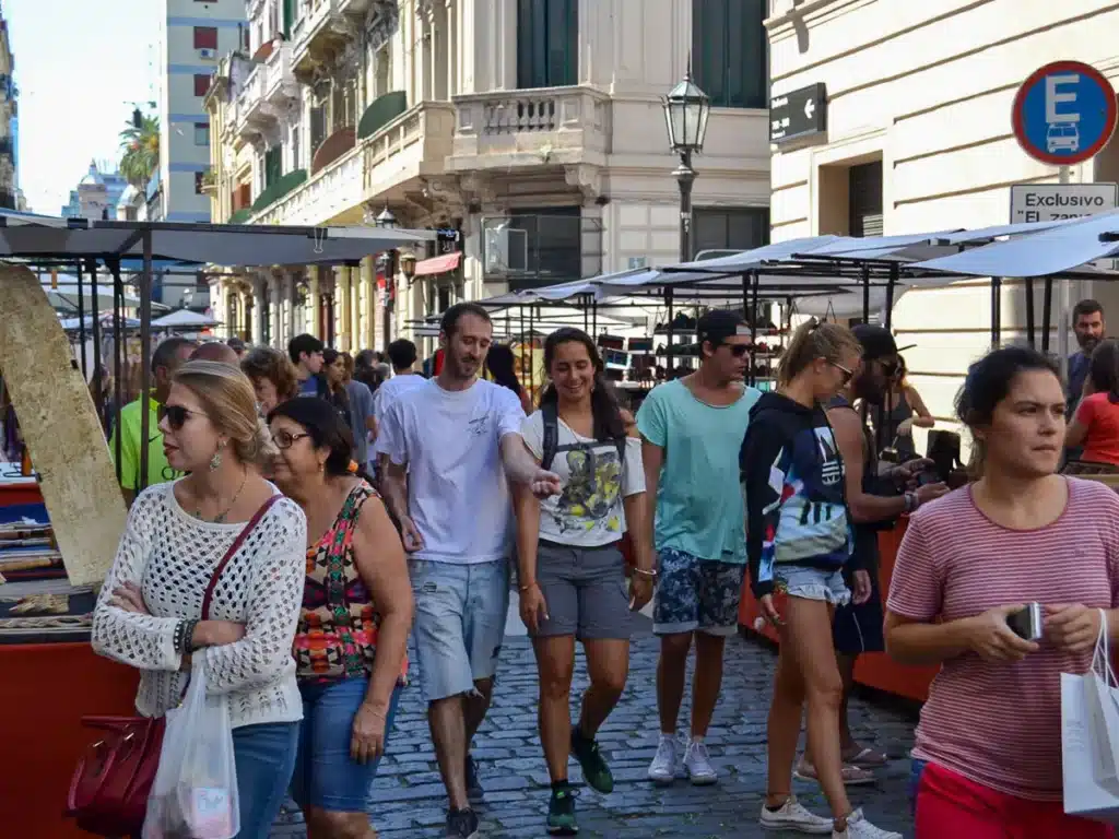 walking around san telmo market in buenos aires on a sunny sunday
