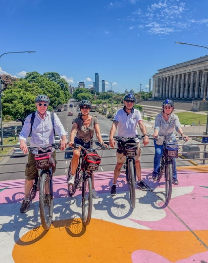 recoleta bridge in buenos aires, a group of 4 pople from USA take a picture during a bike tour with biker street